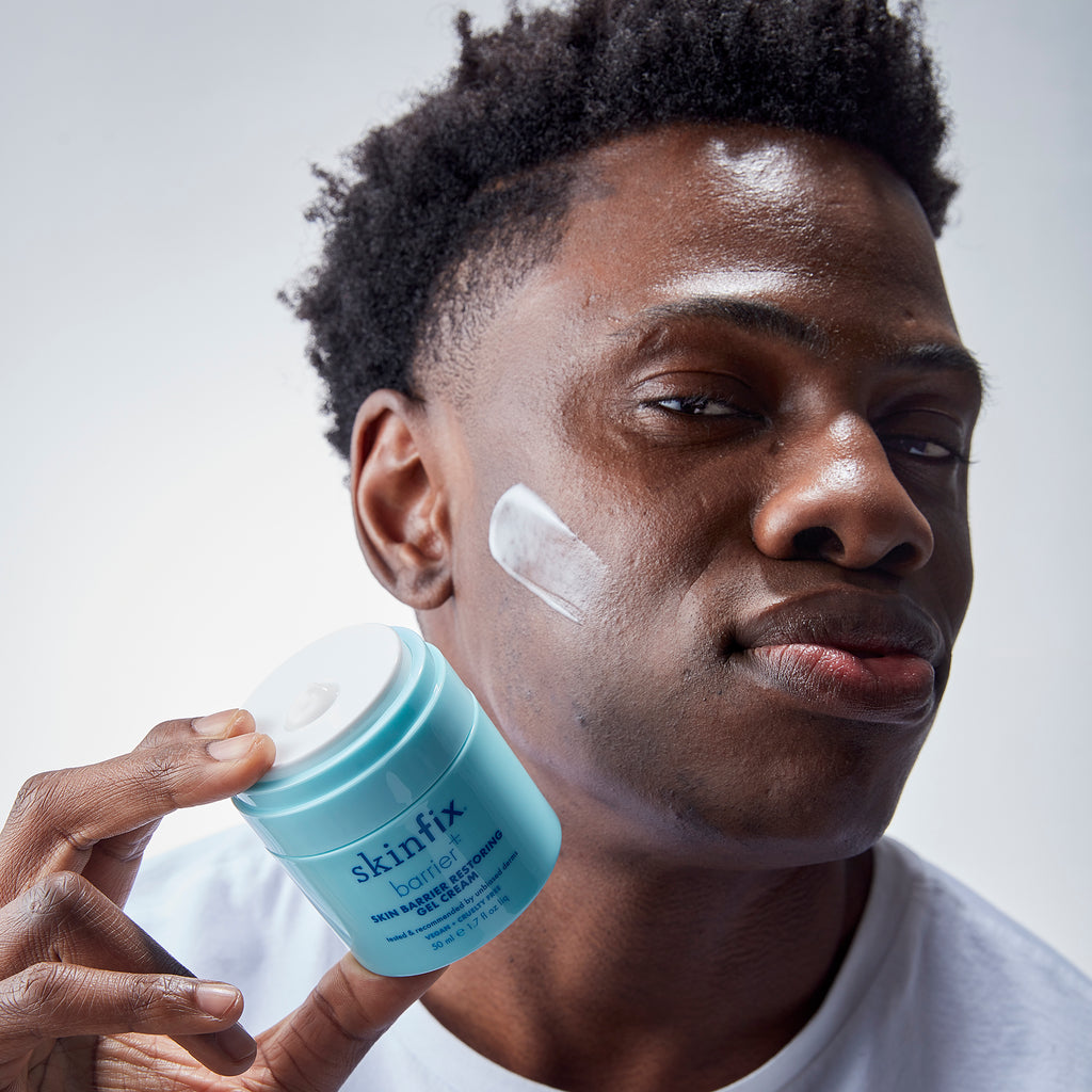 Male holding Skin Barrier Restoring Gel Cream